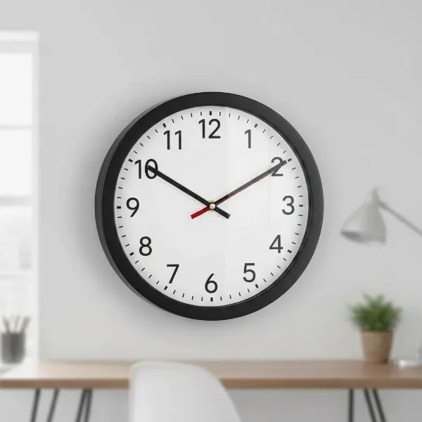Bernhard Products black wall clock with minimalist design, white dial, and large black numbers.
