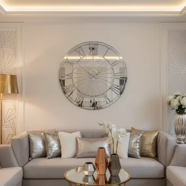 Mirrored wall clock perfectly integrated into a chic glam decor setting with metallic accents.